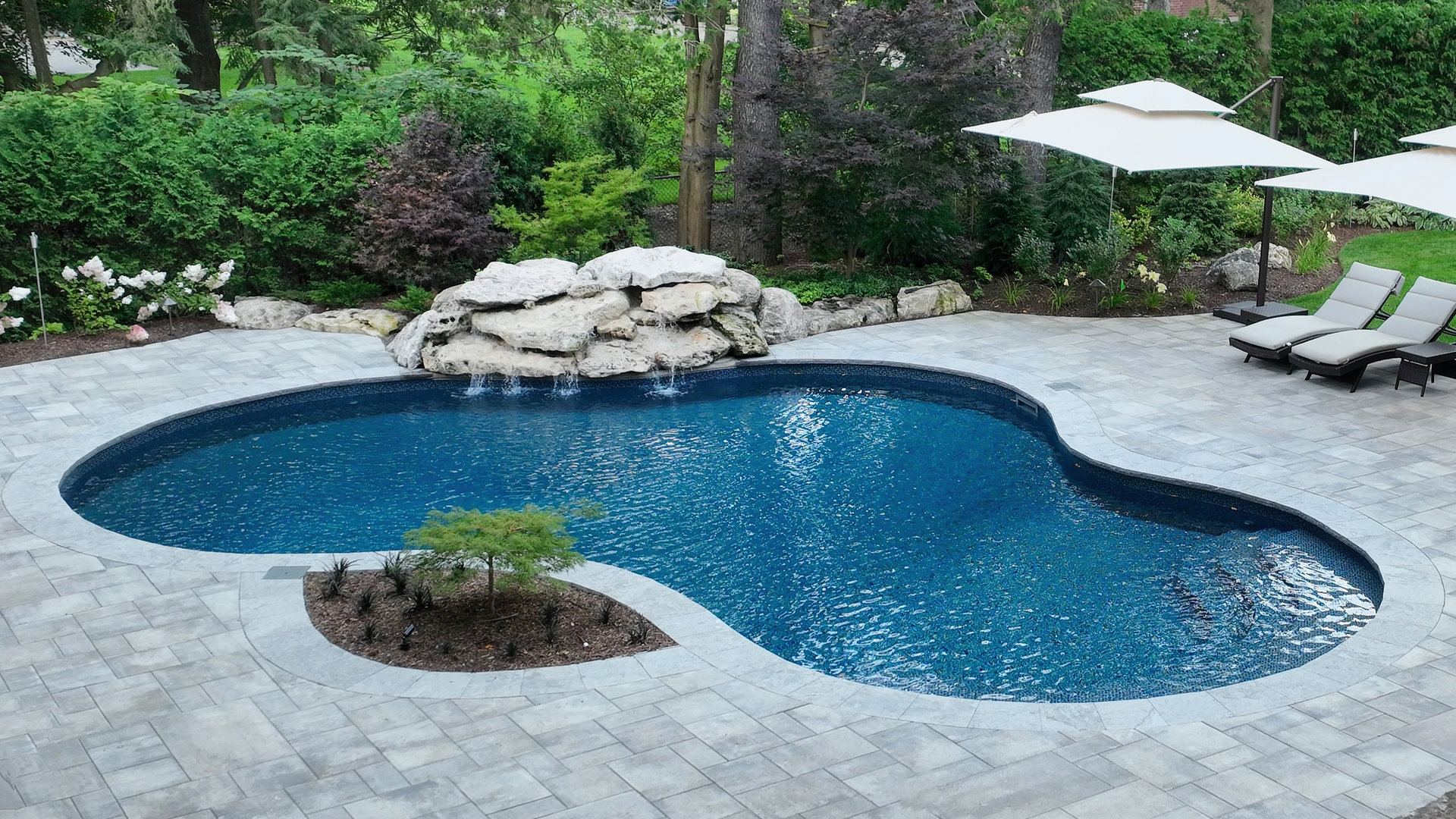 Transform your Burlington backyard with a custom swimming pool design