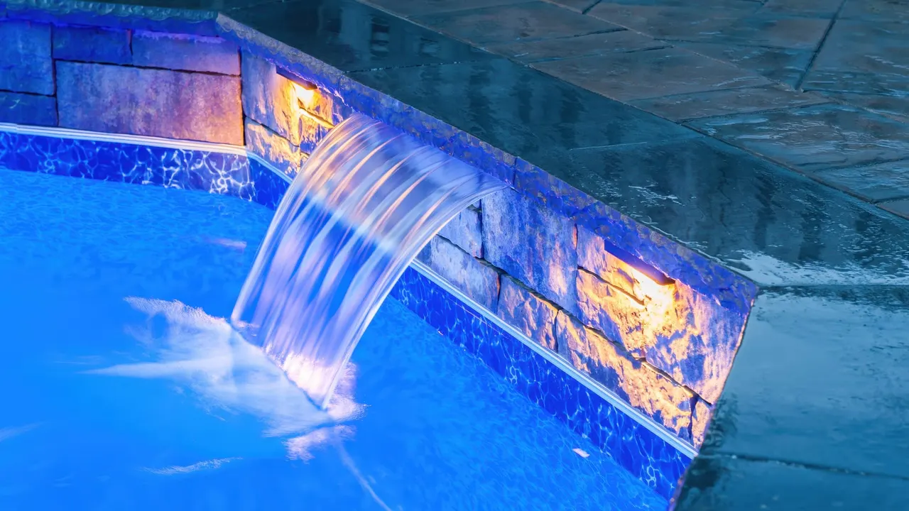 Dramatic waterfall lighting at night