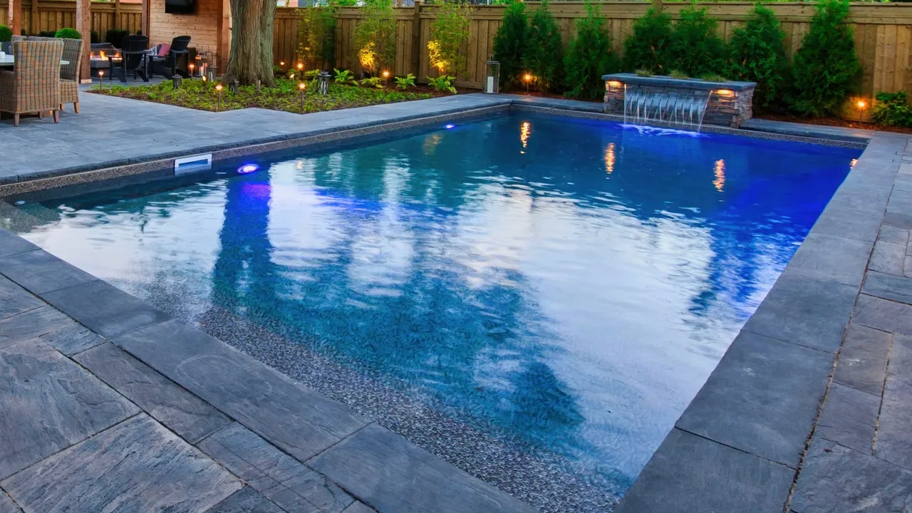 Contemporary swimming pool with glass tile accents