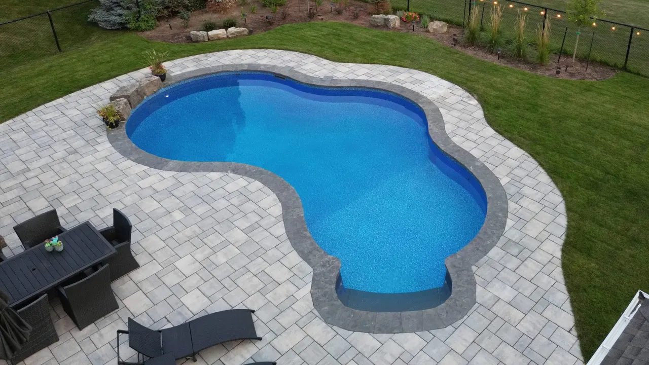 Swimming pool with natural stone coping